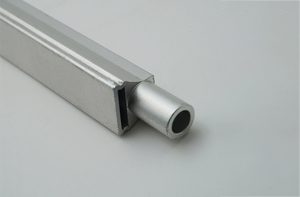 Stainless steel machined slide with CNC-milled profile
