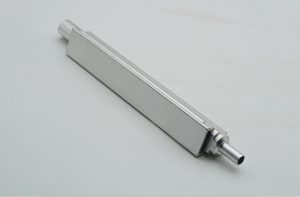 Stainless steel machined slide with CNC-milled profile